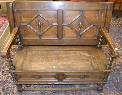 Lot 1353 - Carved oak monks bench