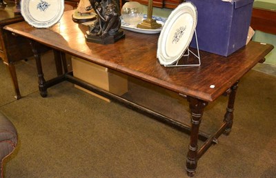 Lot 1365 - Early 20th century oak refectory table with a trestle base, carved with trefoil cut-outs in the...