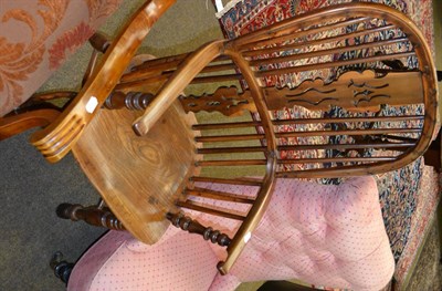 Lot 1397 - Yew and elm Windsor armchair with crinoline stretcher