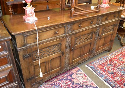 Lot 1409 - Reproduction carved oak sideboard