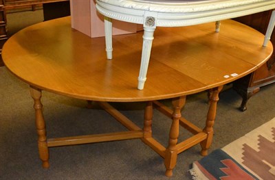 Lot 1420 - Albert ";Eagleman"; Jeffray oak gate leg table, the oval top on turned supports joined by...