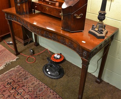 Lot 1462 - Georgian style serpentine fronted mahogany serving table, with anthemion carved frieze and...