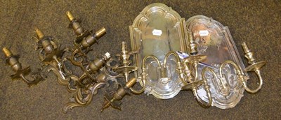 Lot 1474 - Pair of silvered twin branch wall lights and a pair of triple wall lights (4)