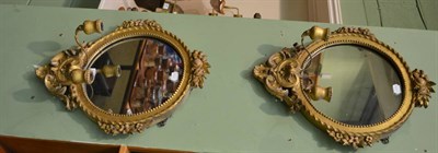 Lot 1475 - Pair of 19th century gilt composition wall mirrors, each with Rococo style borders and twin...