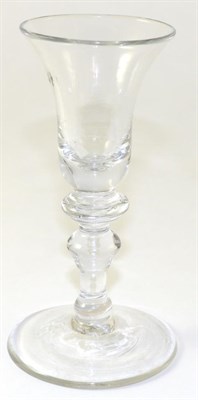 Lot 134 - A Wine Glass, circa 1740, the bell shaped bowl with annular basal knop on a baluster stem and...