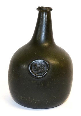 Lot 136 - A Green Glass Sealed Wine Bottle, 18th century, of onion shape, the seal with a lion passant,...