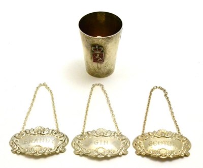 Lot 92 - A set of three silver decanter labels, brandy, scotch and gin, together with a silver measure...