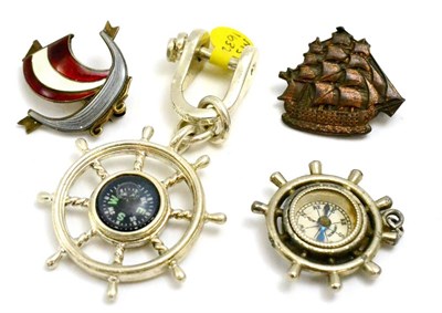 Lot 99 - A group of four sailing related items including a Tiffany & Co silver compass in the form of a...