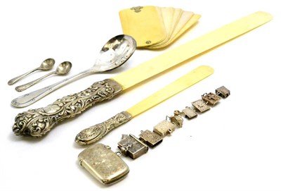 Lot 104 - A group including a silver vesta case, Birmingham, a French spoon with pierced bowl, two 19th...