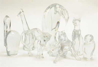 Lot 138 - Seven Baccarat glass animals including a penguin group, an owl, three cats etc