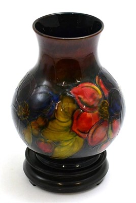 Lot 208 - A Walter Moorcroft Flambé Clematis pattern ovoid vase, blue painted monogram, impressed...