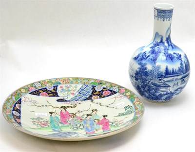 Lot 215 - A Japanese porcelain charger in the Chinese famille rose palette and a modern Chinese blue and...