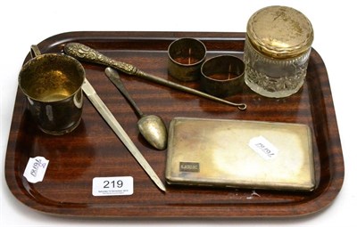 Lot 219 - A group of silver including cigarette case, letter opener, christening cup, two napkin rings,...