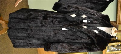 Lot 241 - Dark long mink fur coat and similar dark mink scarf with white mink diamond insertion (2)