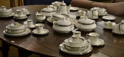 Lot 256 - An extensive Royal Doulton 'Sarabande', dinner service with silvered gilt rim, including dinner...