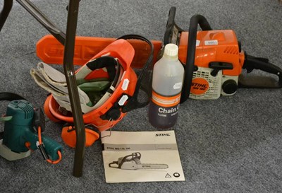 Lot 550 - A Stihl MS180 chain saw, helmet and ear defenders