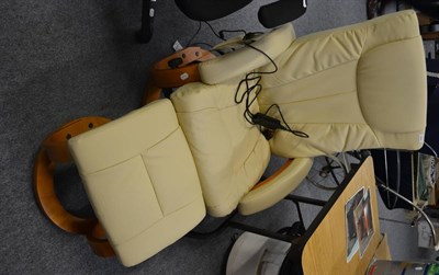 Lot 556 - A leather Stressless reclining chair with massage function