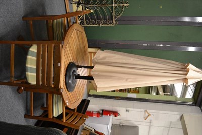 Lot 562 - A set of Gloster garden table, four chairs and a parasol