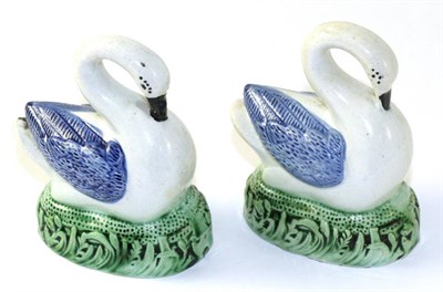 Lot 168 - A Pair of Staffordshire Pearlware Models of Swans, circa 1800, modelled with blue wings on...