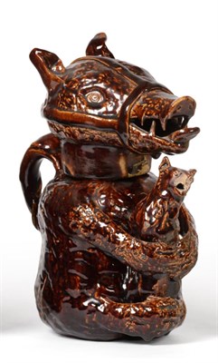 Lot 170 - A Treacle Glaze Pottery Bear Jug and Cover, early 19th century, naturalistically modelled...