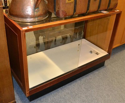 Lot 609 - A glazed shop display cabinet