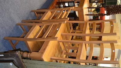 Lot 626 - A modern pine kitchen table, a small pine table and six pine kitchen chairs