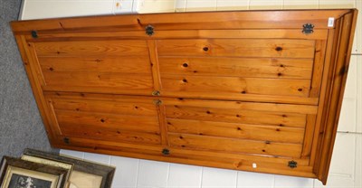 Lot 640 - A pine corner cupboard