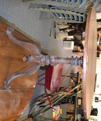 Lot 641 - Victorian oak tripod table with circular top