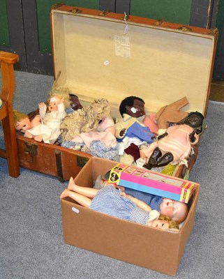 Lot 644 - A trunk containing various plastic jointed dolls, AM 518 bisque head doll, two others (a.f.), dolls