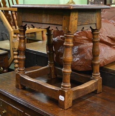 Lot 752 - An oak joint stool