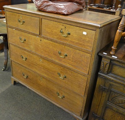 Lot 760 - George III oak chest of drawers, two short over three long