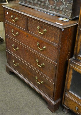 Lot 768 - A George III oak four height chest of drawers