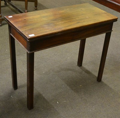 Lot 772 - A George III mahogany fold-over tea table