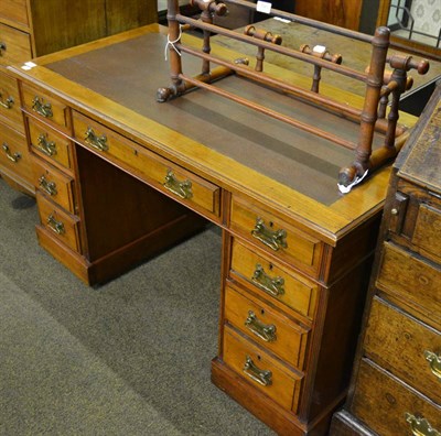 Lot 781 - A leather inset twin pedestal desk together with a chair