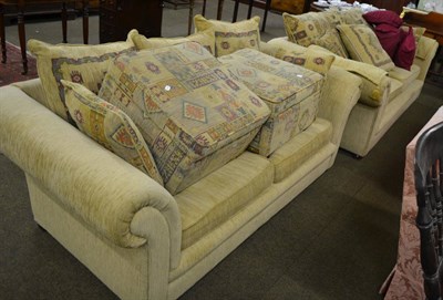 Lot 784 - A two piece suite comprising two seater and four seater settees and two footstools