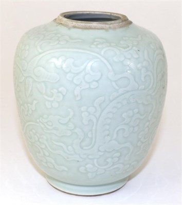 Lot 193 - A Chinese Porcelain Jar, Jaijing reign mark, carved with dragons amongst lotus blossom, six...