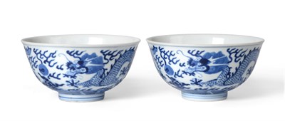 Lot 194 - A Pair of Chinese Porcelain "Dragon" Bowls, Guangxu marks , painted in underglaze blue with...