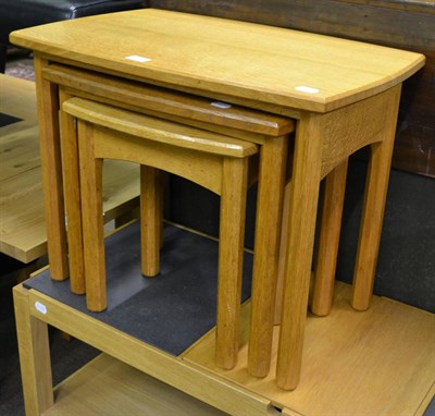 Lot 820 - A nest of three modern light oak occasional tables by Philip Baso