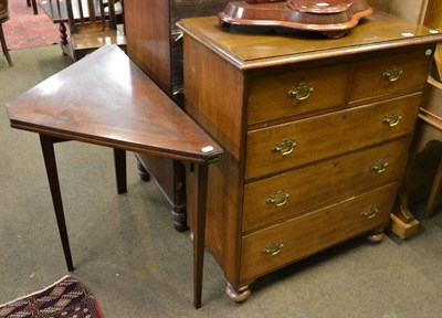 Lot 824 - A 19th century mahogany foldover card table of triangular shape and an oak four height chest of...