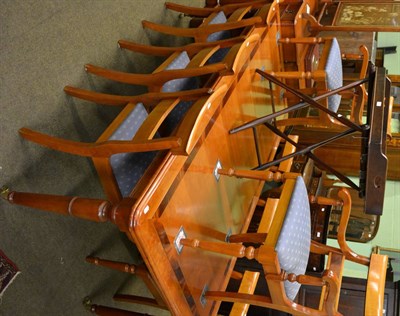 Lot 826 - A Charles Barr dining room suite comprising table, eight chairs and two sideboards