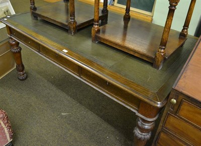 Lot 845 - Victorian oak leather inset writing table