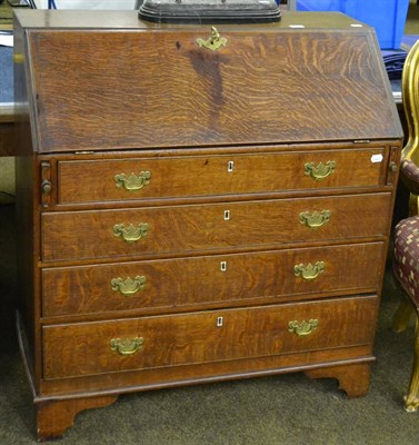 Lot 855 - A Georgian oak bureau