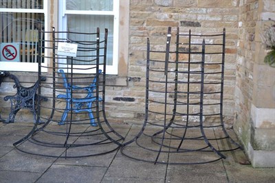 Lot 856 - A set of four iron hay racks