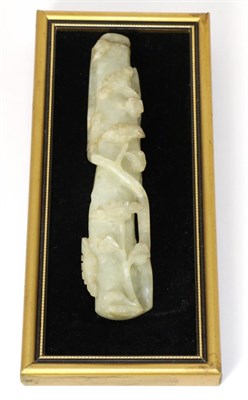 Lot 201 - A Chinese Jade Handle, worked in relief with flowering branches, 16.5cm long