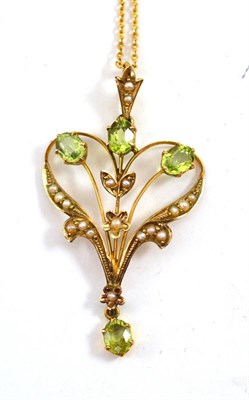 Lot 10 - A peridot and seed pearl pendant on chain