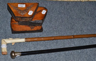 Lot 77 - Three printing blocks, bone handled walking cane and a silver topped cane