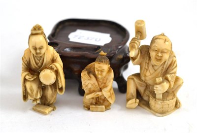 Lot 95 - Three circa 1920 Japanese ivory figures and hardwood stand
