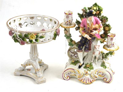 Lot 114 - A Chelsea Derby candlestick modelled as a bagpipe player and dog (a.f.) and a Continental porcelain