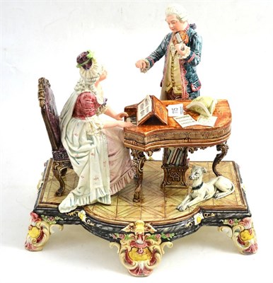 Lot 115 - An Austrian earthenware figure group of a music lesson (a.f.)