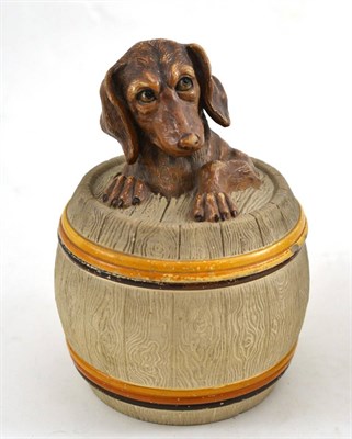 Lot 121 - German ceramic tobacco jar of barrel shape, with cover with Dachshund finial